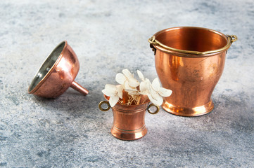 Set of 3 copper miniatures on concrete background