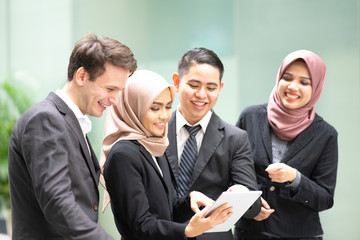 Group of business staff join together