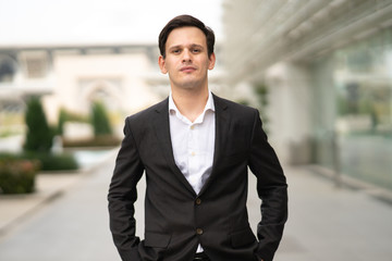 Businessman portrait with blurred background.