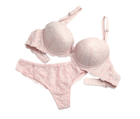 Elegant pink women's underwear isolated on white, top view