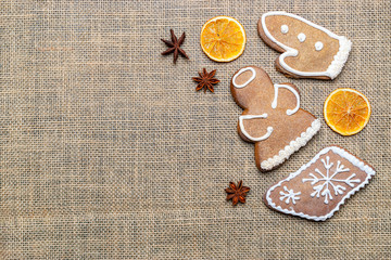 Christmas background. Handmade festive gingerbread cookies. Copy space for text. Winter holidays background mock up