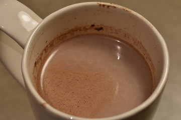 A close up of some hot chocolate in a ceramic mug