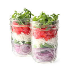 Healthy salad in glass jars isolated on white