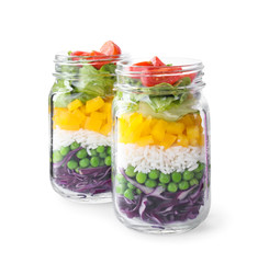 Fototapeta na wymiar Healthy salad in glass jars isolated on white