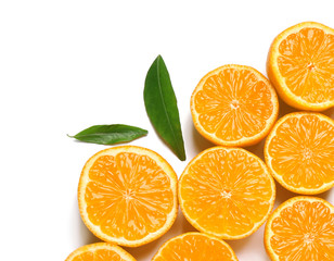 Composition with halves of fresh ripe tangerines and leaves on white background, top view. Citrus fruit