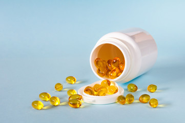 Soft yellow gelatin capsules oval shape. They are used in the pharmaceuticals for vitamins A, D, E and other medicines