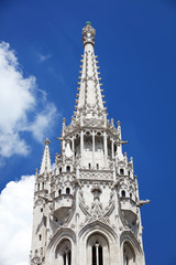 Fototapeta na wymiar Matthias Church, a church located in Budapest, Hungary, in front of the Fisherman's Bastion at the hill of Buda's Castle District