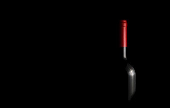 wine bottle isolated in the dark. red wine bottle background