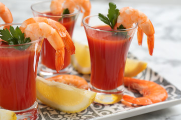 Delicious shrimp cocktail with tomato sauce, closeup
