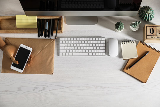 Designer's workplace with modern computer and stationery, flat lay. Space for text