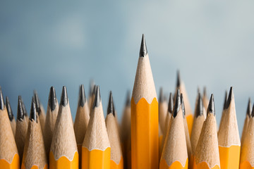 Sharp graphite pencils on grey background, closeup