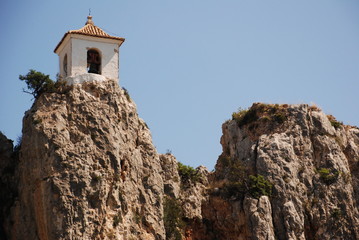 Fototapeta premium lttle old church on a mountain with a clear blue sky