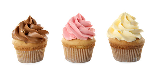 Delicious birthday cupcakes decorated with cream on white background