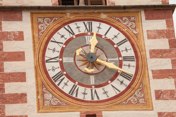 Naklejka premium A detail of the clock painted on the bell tower of the St. Cristina little church in Val Gardena, recently restored it shows all its original vivid colors