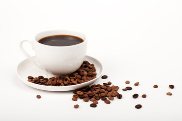 cup of coffee with beans on white background
