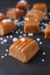 Salted caramel on grey table, closeup view