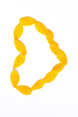 Fototapeta premium Orange cosmos flowers on a bright white isolated background