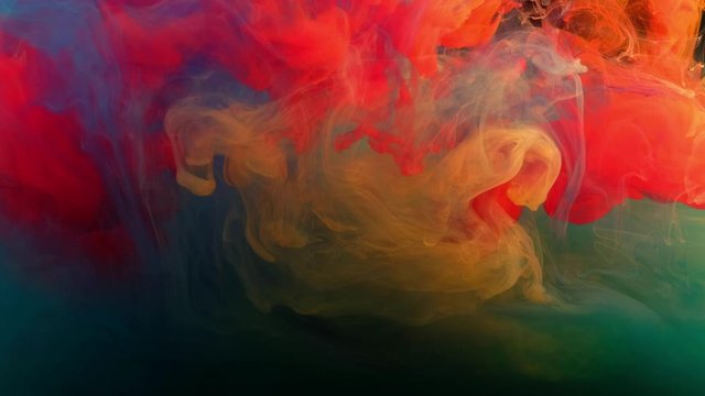 Color paint drops in water , abstract color mix , drop of Ink color mix paint falling on water Colorful ink in water, 4K footage,