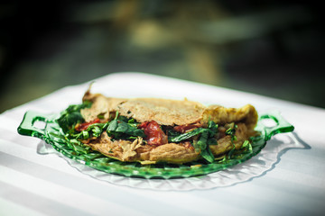 Delicious meal captured from above under the sun. Hard shadows and highlights capturing the details of the dish. Vegetarian healthy food prepared at home.