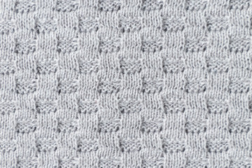 The closeup texture knitted fabric from cotton threads. Background textile surface with copy space for text