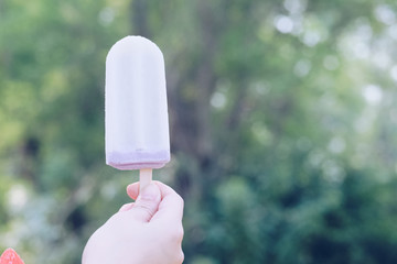 ice cream with blurred green bokeh and nature background