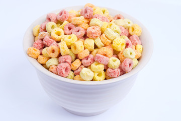 Cereal flakes in bowl on white background
