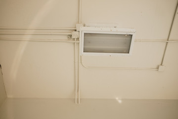 Lighting and bright pipe systems. Electrical wiring work in a steel pipe of a house