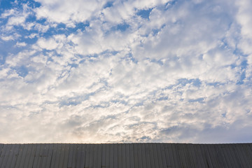 Fototapeta premium Wall with beautiful cloudy sky