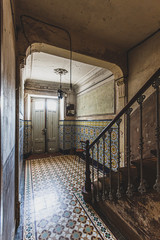 Entrance of old and ruined abandoned house.