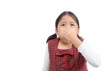 Asian girl holding her nose because of a bad smell isolated