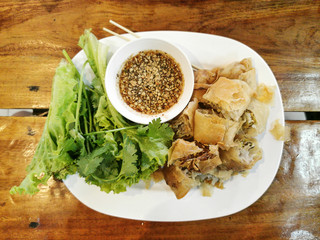 Top view spring rolls, Crispy deep fried shrimp spring rolls on tiled dishes thai style.