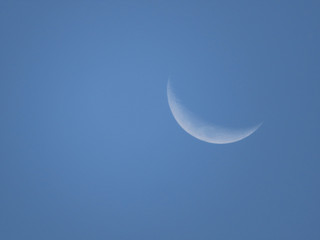 Obraz na płótnie Canvas Crescent moon in the blue sky