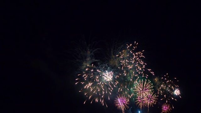 Beautiful abstract colourful Fireworks explode display on sky at night a symbol of celebration in New years anniversary for background