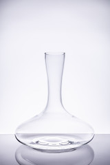 Luxury cristal decanter on the light background.. Fine cristal glassware concept. Vertical in light...
