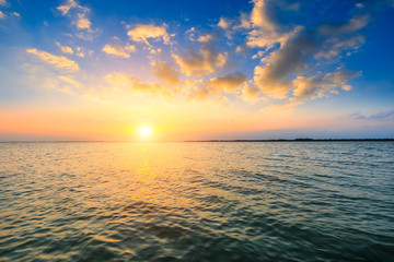 Dreamy sunset landscape by the lake