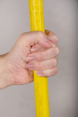 hand with broom