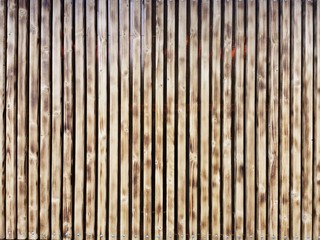 Wooden thin slats with traces of firing. Thin vertical slats.Wooden background. Abstract background. 