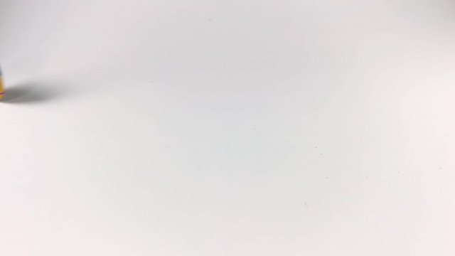 Yellow poker chip spinning on a white table, ISOLATED, STILL