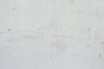 Scratched and in some places rusted white gates