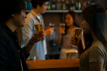 man and girl with beer mug in restaurant