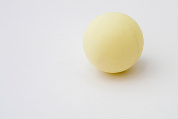 old ping pong ball on white. copy space.