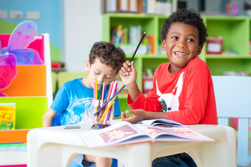Portrait of mixed race student kids studying in international elementary school. education, mixed race, social distancing or homeschooling concept