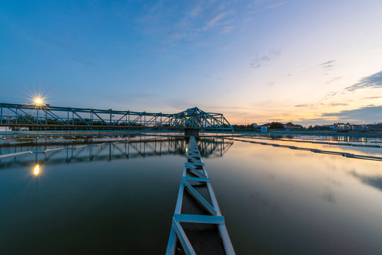 Water treatment plant with sunset