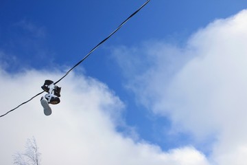 Shoes tossed over a wire