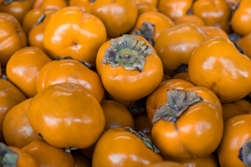 New fresh persimmons for sale at local farmers market