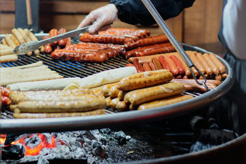 Street food at the main city fair Kebab, corn, grilled sausages.