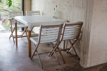 White tables and chairs in Cafe