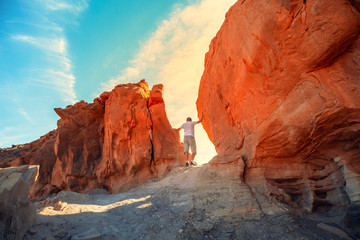 A man climbs on a rock. Desert natural landscape. Timna Park. Israel