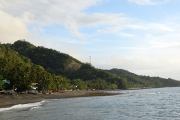 San Juan, Batangas, Philippines - December 26, 2019: Tropical island beach resort along sea shore