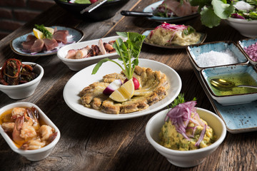 cooked fish and various appetizers